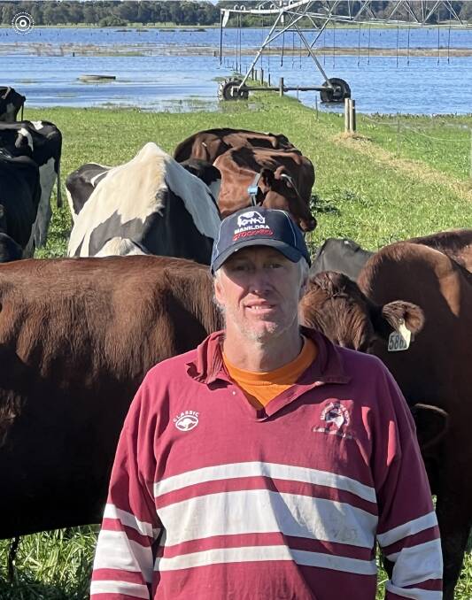NSW South Coast dairy farmer Tim Cochrane with water logged paddocks. Picture supplied.