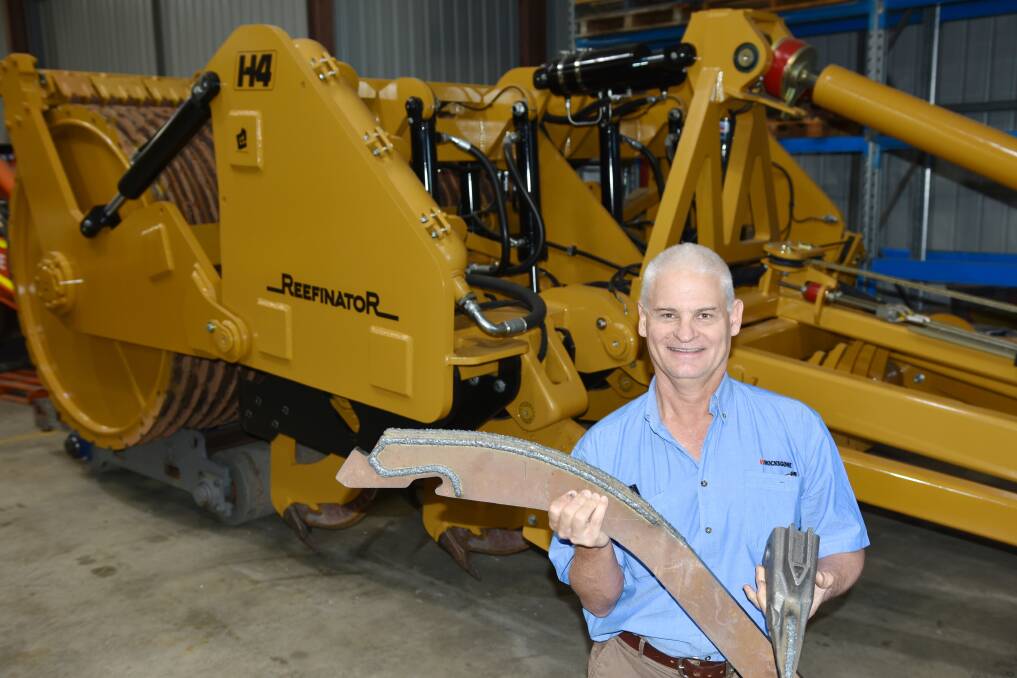 Rocks Gone's Tim Pannell with the ripper boot and leading edge replacement parts used by the company's H4 Reefinator, which also now features automation technology, easing demands on operators and improving machine and tractor performance. Picture supplied
