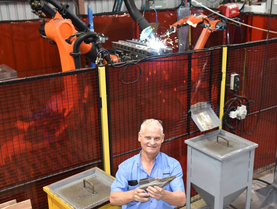 Rocks Gone is now using some of the world's latest automated robotic technology (pictured) to completely fabricate its hard-facing replacement parts, ensuring precision and uniformity. Pictured is Rocks Gone's Tim Pannell. Picture supplied