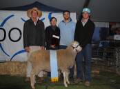 John, Robyn, James and Peter Nadin, Macquarie Dohne stud, Ballimore, NSW, with their supreme champion Dohne ewe and the trophy in memory of their late son and brother, Tom. Picture by Barry Murphy 