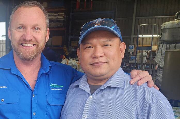 General manager, and former owner, of the LiquaForce liquid fertiliser business bought by RLF AgTech, Cameron Liddle, with RLF South East Asia general manager, Frank Lu, at LiquaForce's Ingham plant in Queensland.