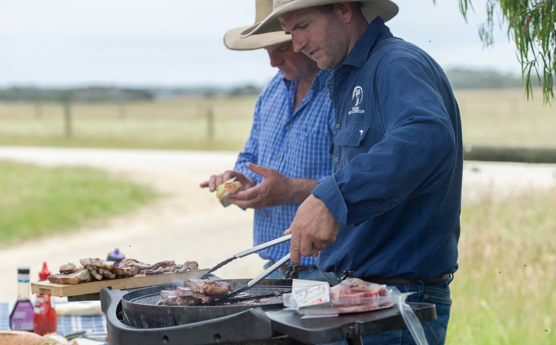 Victorian livestock producers and Coles suppliers James and Mick Kyle, Lower Tarwin, firing up the barbie. Picture supplied by Coles.