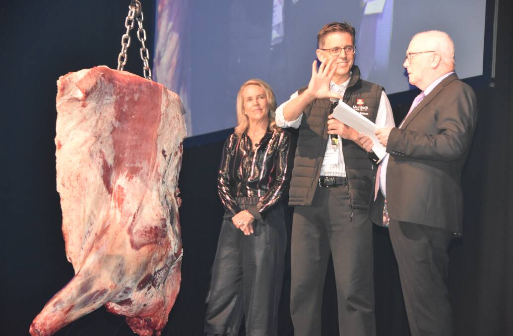 Dr Graham Gardiner talks carcase measurement on stage at Beefex22 with ALFA president Barb Madden and MC Gerry Gannon.