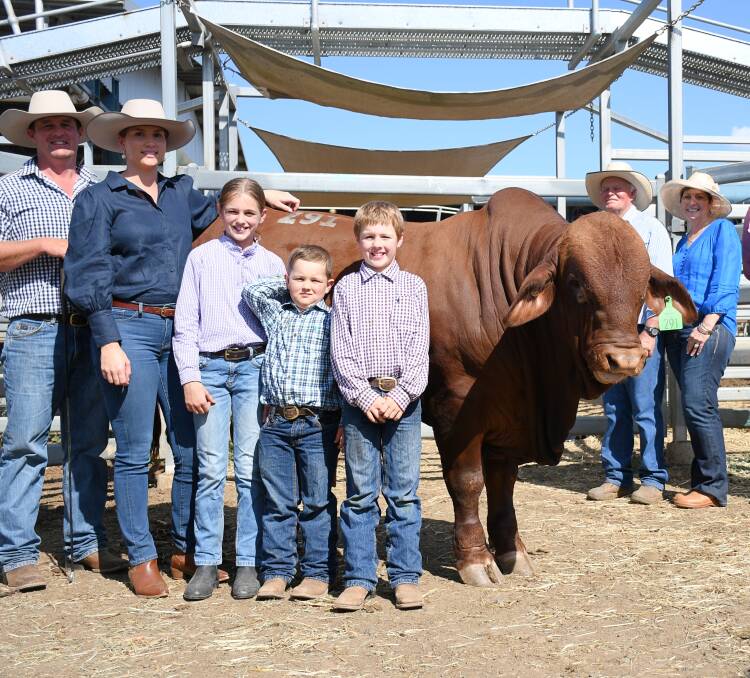 The record-setting $220,000 bull of the 2022 sale Oasis A Long John, with vendors Adam, Shelley, Mackenzie, Connor, and Archie Geddes, and buyers Peter and Deleece Carrington. Picture by Clare Adcock 