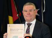 Federal Agriculture Minister Murray Watt holding the government's response to the Independent Panel's report on the phase-out of live sheep exports at an impromptu press conference on May 11 in Perth.