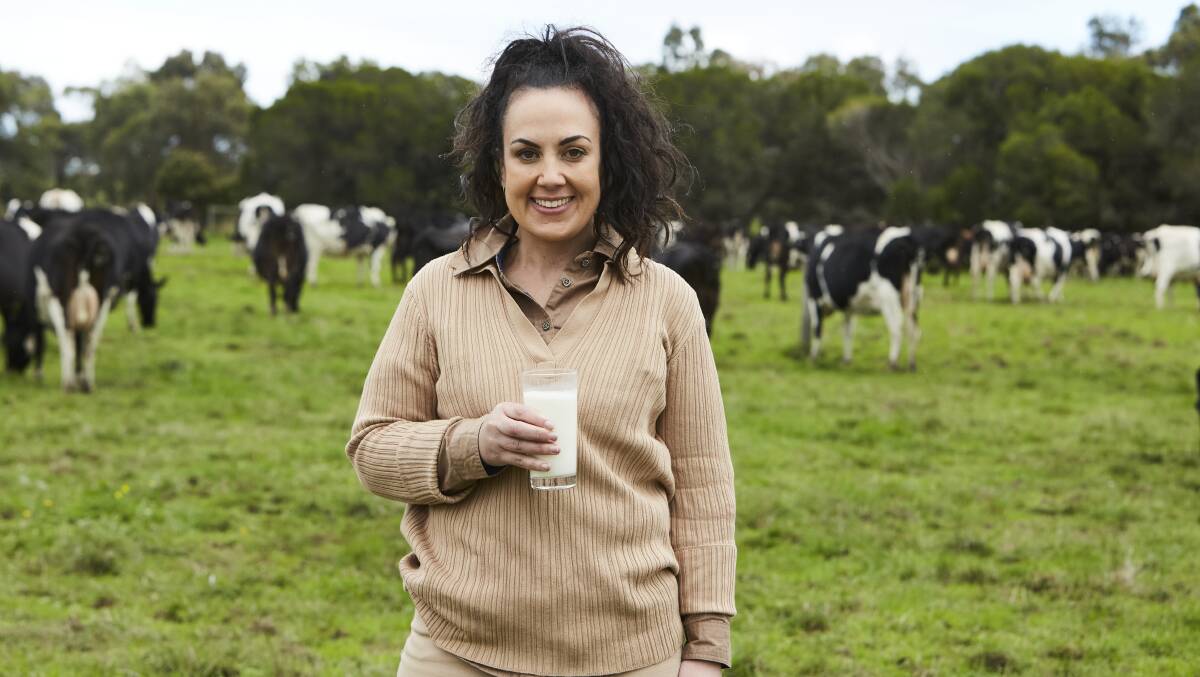 Sarah Kelly runs what might be one of the closest dairy farms to Melbourne's central business district at Skye with her father Gerry. Picture supplied by Dairy Australia