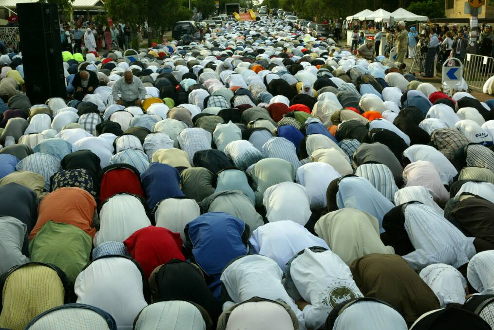 Muslim worshippers spill over onto the road outside Lakemba Mosque to pray on the day that they celebrate Eid Al Ad-Ha, also known as The Festival of Sacrifice. File photo. Photograph Steven Siewert 