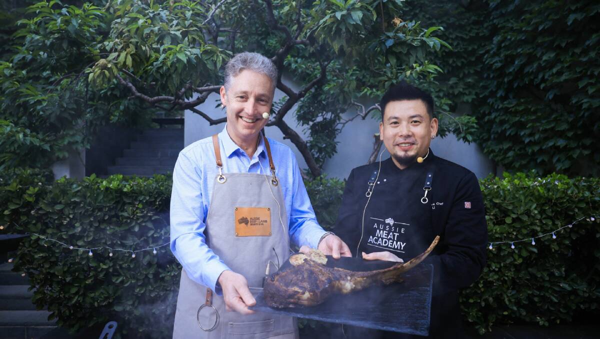 Australian ambassador to China Scott Dewar and chef Reggie Li at an embassy event held in Beijing to promote red meat. Picture supplied. 