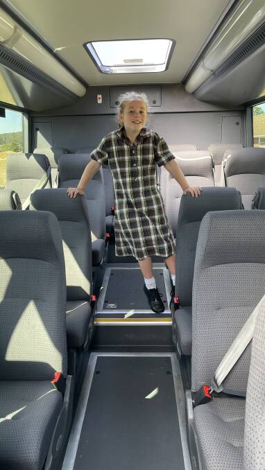 Isla McErvale checks out the wool blend seats on the school bus owned by her family. Picture supplied. 
