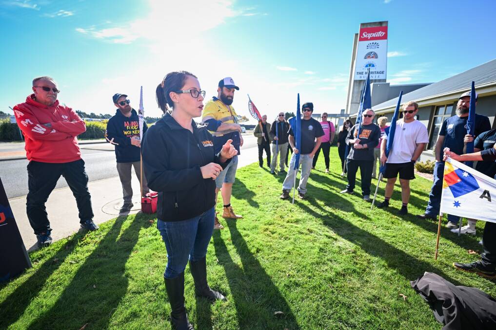 Unions Tasmania secretary Jessica Munday addresses workers at the Saputo cheese factory in Burnie. Picture by Katri Strooband