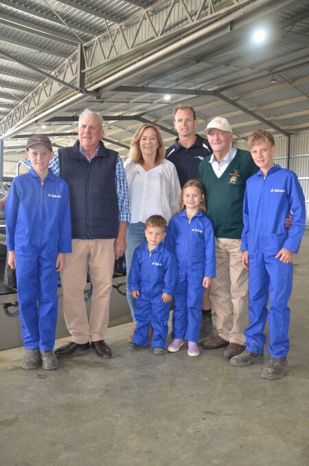 Mount Compass dairyfarmers Hayden Byrne, Rob, Mandy and Nick Brokenshire, with Arlo and Mia Brokenshire, Peter Whitford and Harry Byrne, at their new rotary dairy. Photo by Vanessa Binks 
