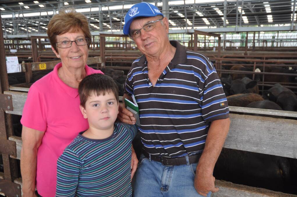 BIG BONUS: Jean and Phil Biggins, Biggin Hill Trust, Lochaber, and grandson Billy White were thrilled to top the heifer offering at $3.57/kg for a pen of 328kg Angus. Their 63 heifers topped at $1173. The previous day, their 67 March/April-drop Pathfinder-blood steers made to $1193, av $1105.